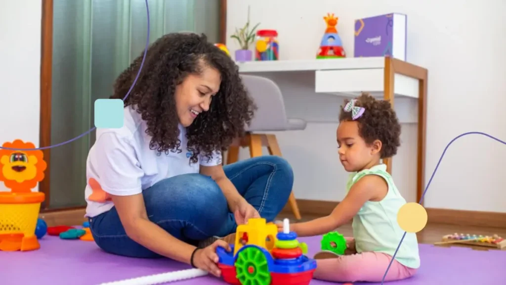 Espaços acolhedoras da Genial Care. Terapeuta brincando com menina em uma sala sensorial