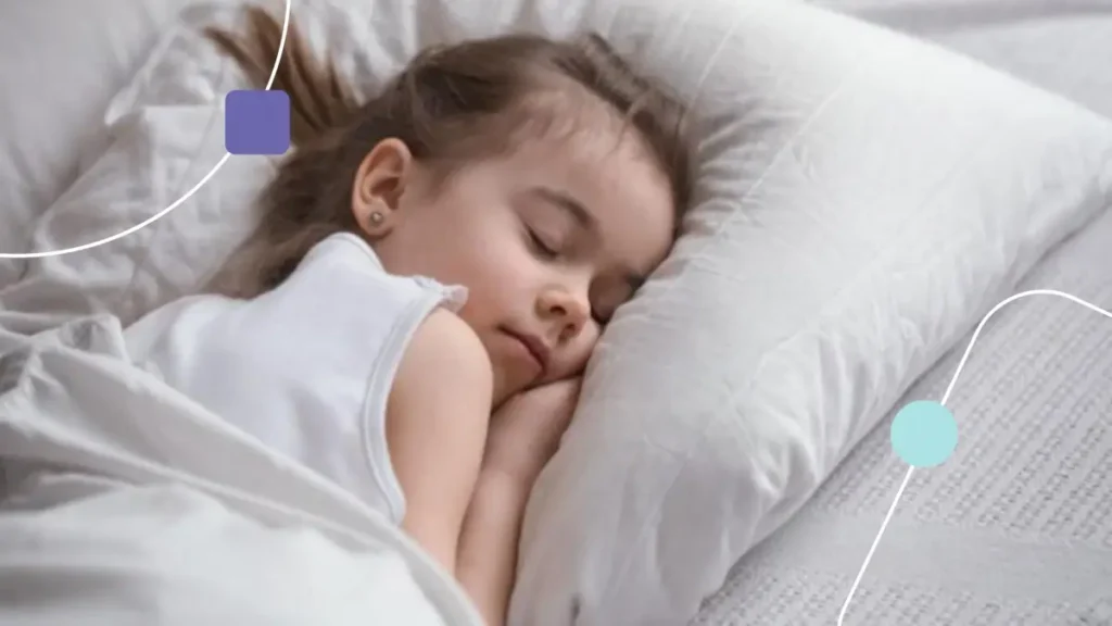 Menina dormindo. Ela tem autismo e sono