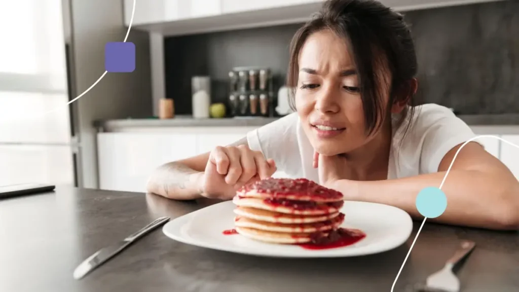 Pessoa admirando panquecas com geleia. Colesterol e autismo